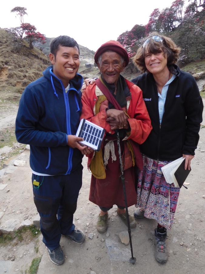 Solukhumbu Trek April/May 2016 - Chhiring and Val, with an elderly monk receiving his LED light, Bhulbhule
